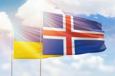 Sunny blue sky and flags of iceland and ukraine