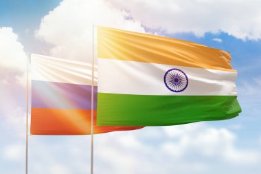 Sunny blue sky and flags of india and russia