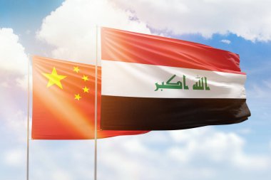 Sunny blue sky and flags of iraq and china