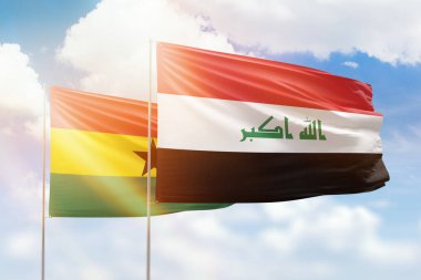 Sunny blue sky and flags of iraq and ghana