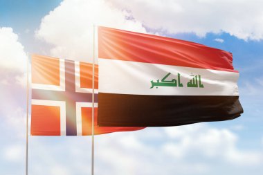 Sunny blue sky and flags of iraq and norway