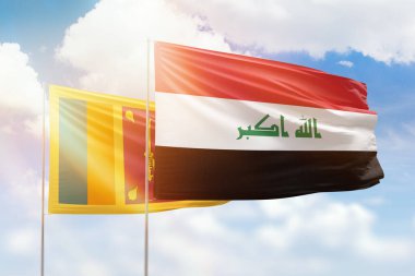 Sunny blue sky and flags of iraq and sri lanka
