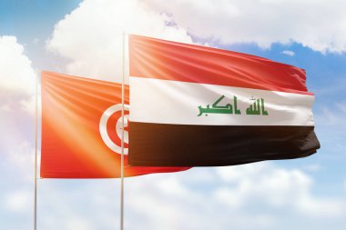 Sunny blue sky and flags of iraq and tunisia