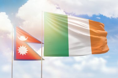 Sunny blue sky and flags of ireland and nepal