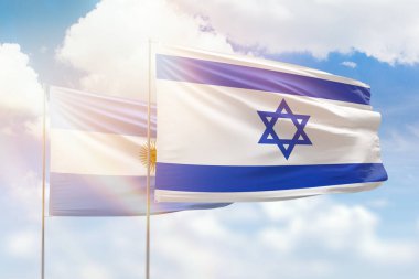 Sunny blue sky and flags of israel and argentina