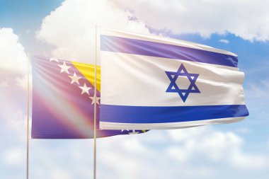 Sunny blue sky and flags of israel and bosnia