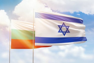 Sunny blue sky and flags of israel and bulgaria