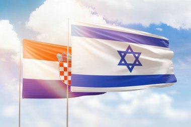 Sunny blue sky and flags of israel and croatia