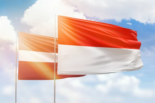 Sunny Blue Sky Flags Indonesia Latvia — Zdjęcie stockowe