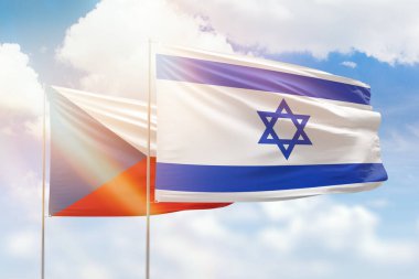 Sunny blue sky and flags of israel and czechia