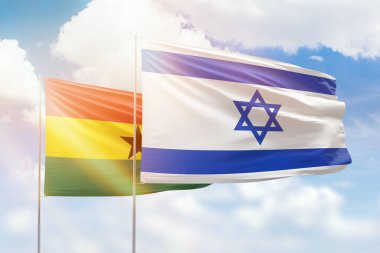 Sunny blue sky and flags of israel and ghana