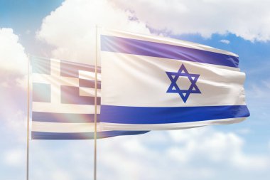 Sunny blue sky and flags of israel and greece