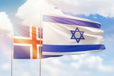 Sunny blue sky and flags of israel and iceland