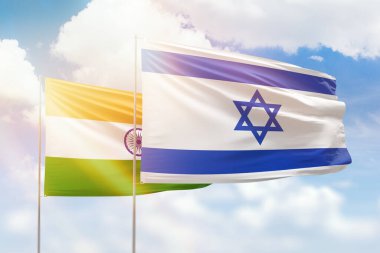 Sunny blue sky and flags of israel and india