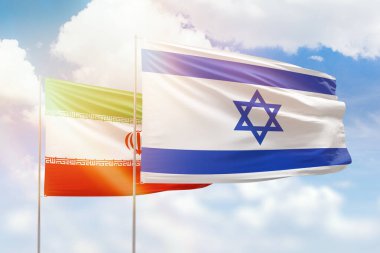 Sunny blue sky and flags of israel and iran