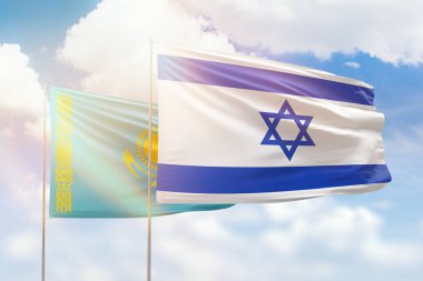Sunny blue sky and flags of israel and kazakhstan