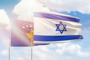 Sunny blue sky and flags of israel and kosovo