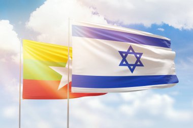 Sunny blue sky and flags of israel and myanmar