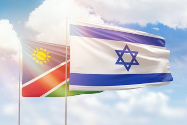 Sunny blue sky and flags of israel and namibia