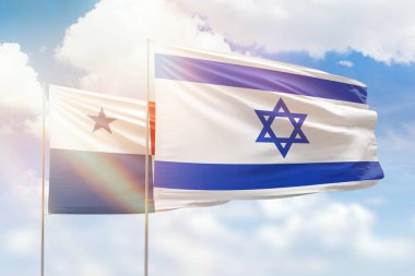Sunny blue sky and flags of israel and panama