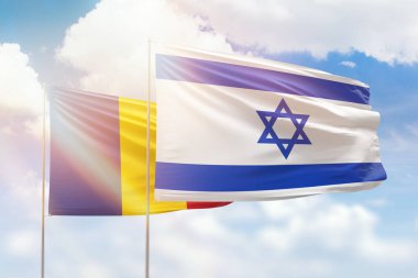 Sunny blue sky and flags of israel and romania