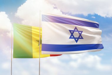 Sunny blue sky and flags of israel and senegal