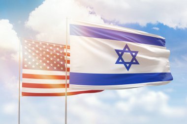 Sunny blue sky and flags of israel and usa