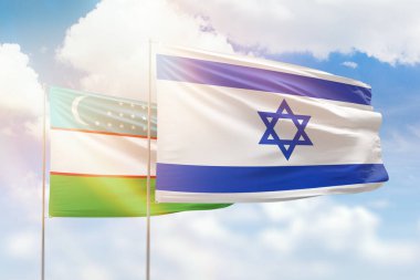 Sunny blue sky and flags of israel and uzbekistan