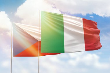 Sunny blue sky and flags of italy and czechia