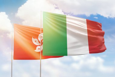 Sunny blue sky and flags of italy and hong kong