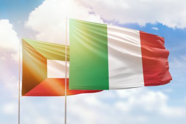 Sunny blue sky and flags of italy and kuwait