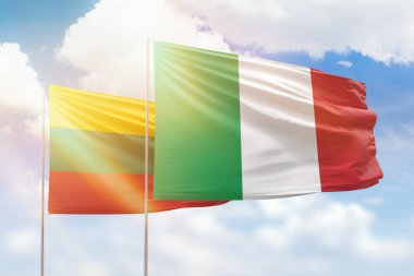 Sunny blue sky and flags of italy and lithuania