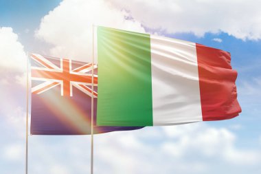 Sunny blue sky and flags of italy and new zealand