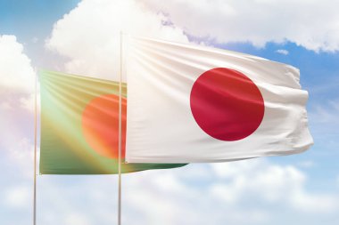 Sunny blue sky and flags of japan and bangladesh