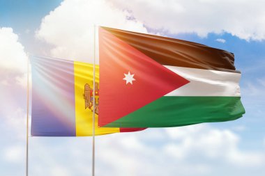 Sunny blue sky and flags of jordan and moldova