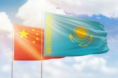 Sunny blue sky and flags of kazakhstan and china