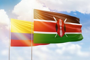 Sunny blue sky and flags of kenya and colombia
