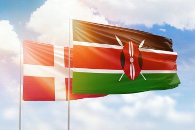 Sunny blue sky and flags of kenya and denmark