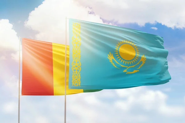 Sunny Blue Sky Flags Kazakhstan Guinea — Zdjęcie stockowe