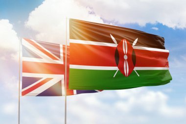 Sunny blue sky and flags of kenya and united kingdom