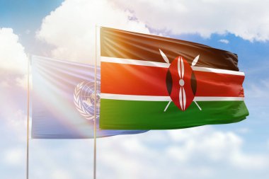 Sunny blue sky and flags of kenya and united nations