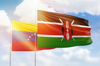 Sunny blue sky and flags of kenya and venezuela