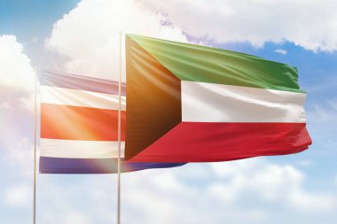 Sunny blue sky and flags of kuwait and costa rica