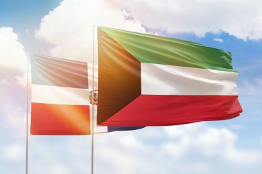 Sunny blue sky and flags of kuwait and dominican republic