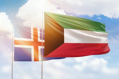 Sunny blue sky and flags of kuwait and iceland