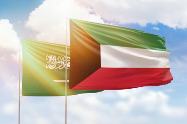 Sunny blue sky and flags of kuwait and saudi arabia