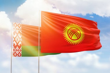Sunny blue sky and flags of kyrgyzstan and belarus