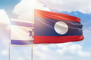 Sunny blue sky and flags of laos and israel