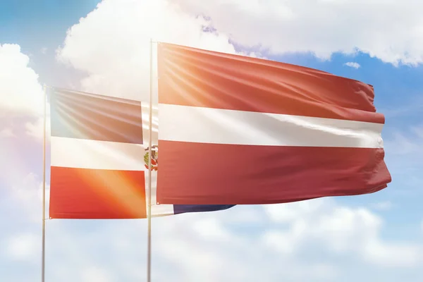 Sunny Blue Sky Flags Latvia Dominican Republic — Stock fotografie