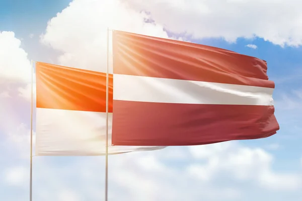 Sunny Blue Sky Flags Latvia Indonesia —  Fotos de Stock